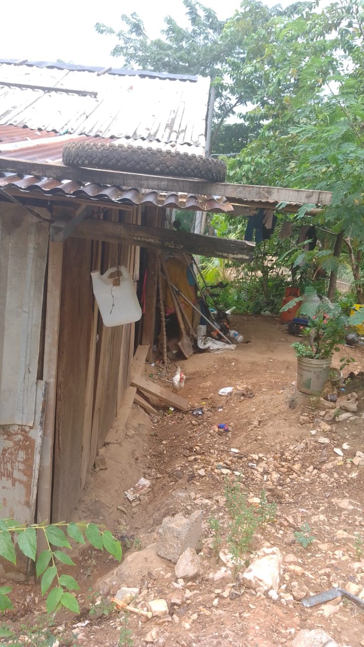 Before: a family's home before RVT students helped rebuild it