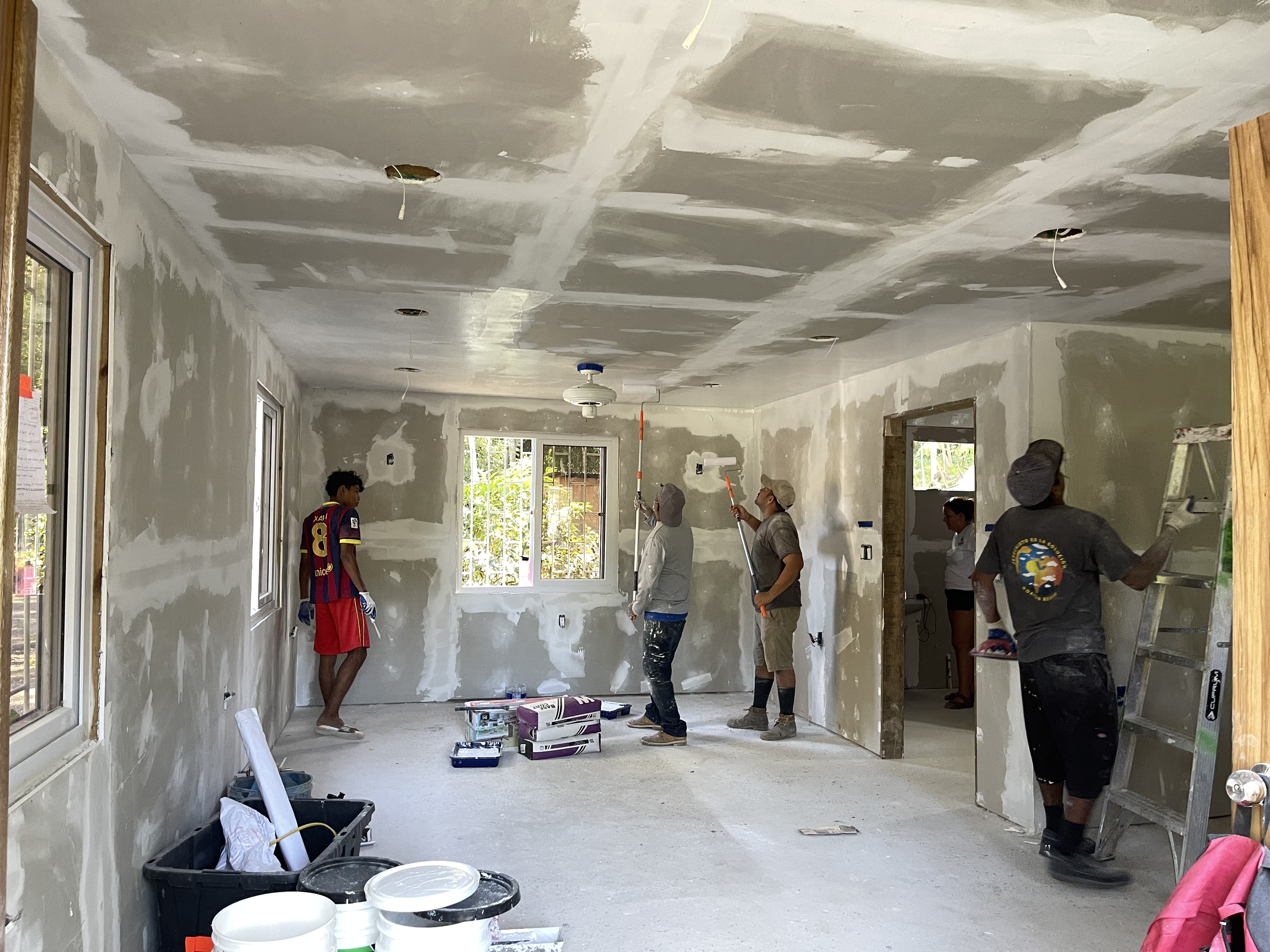 RVT students working on interior construction inside a Hearts for Homes house build
