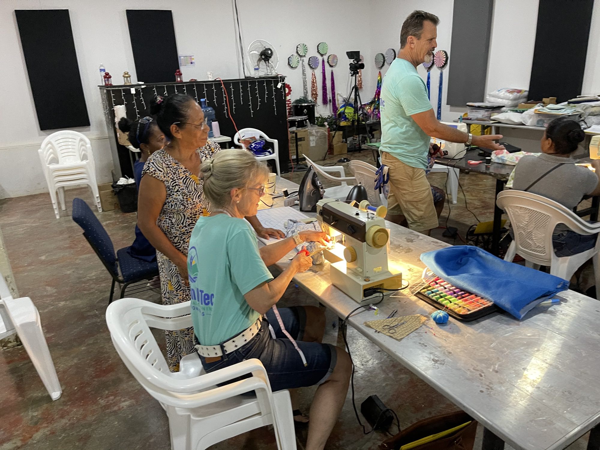Women in RVT sewing and textiles class learning vocational skills in Roatan Honduras